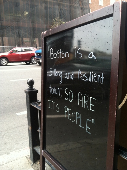 A sign outside of a restaurant on Newbury street, near Boylston, echoes the words of President Obama in a press conference held Monday night./ PHOTO BY HILARY RIBONS